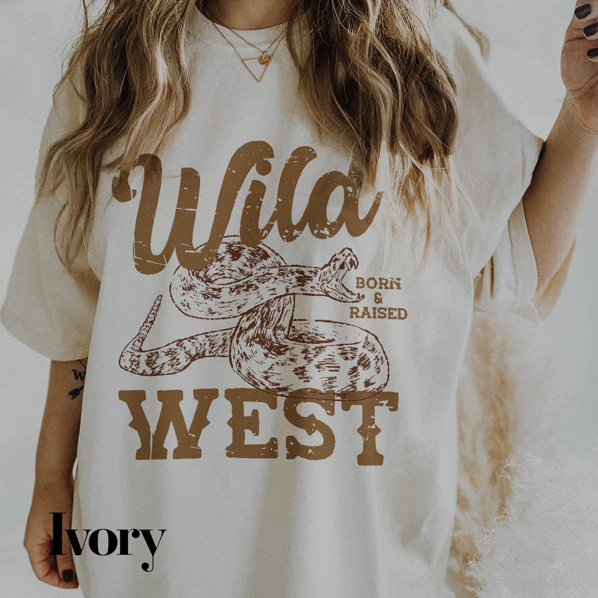 a woman wearing a wild west t - shirt and smoking a cigarette