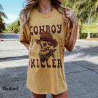 a woman wearing a cowboy skull t - shirt