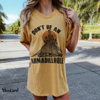 a woman in a yellow shirt is posing for a picture
