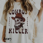 a woman wearing a cowboy shirt with a skull on it