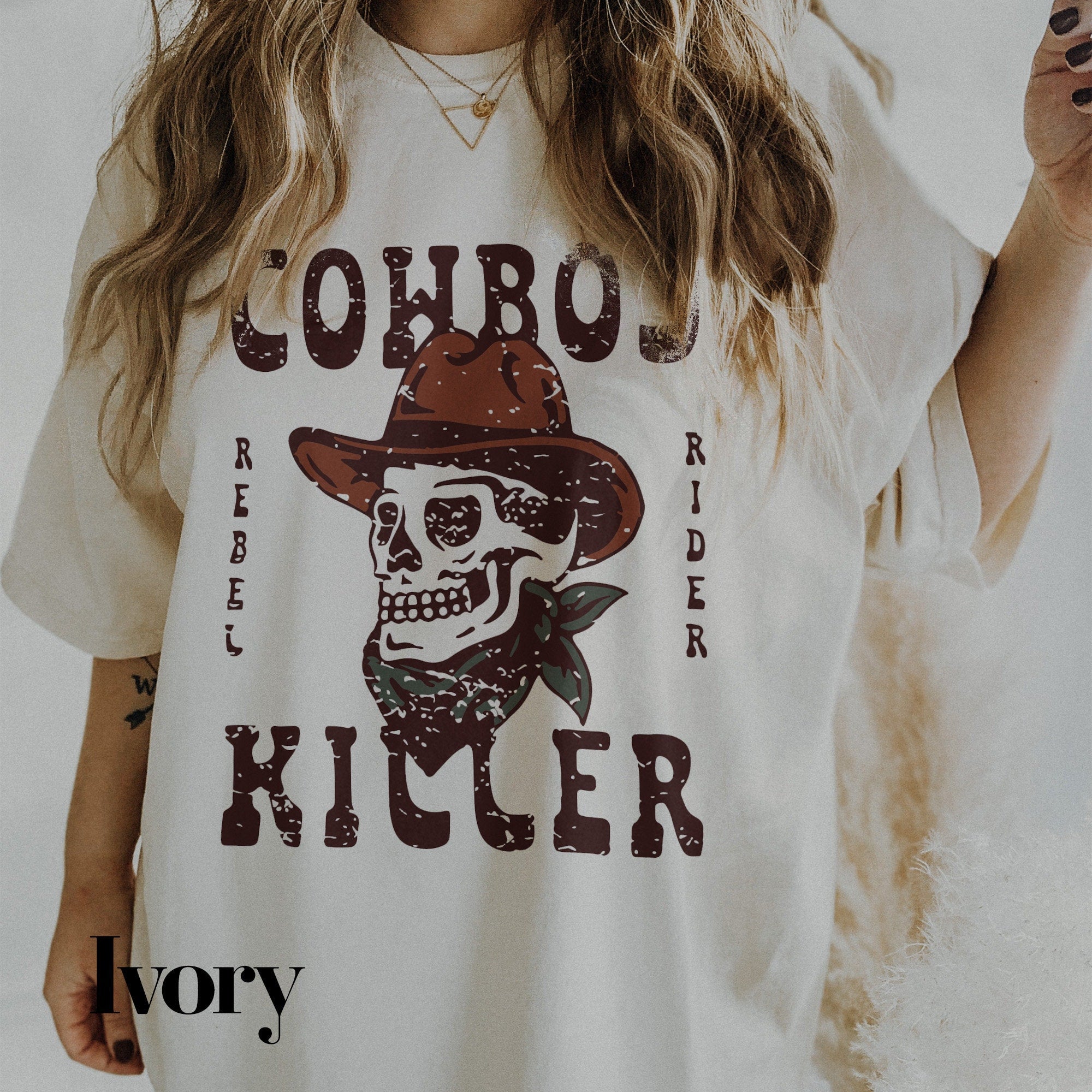 a woman wearing a cowboy shirt with a skull on it