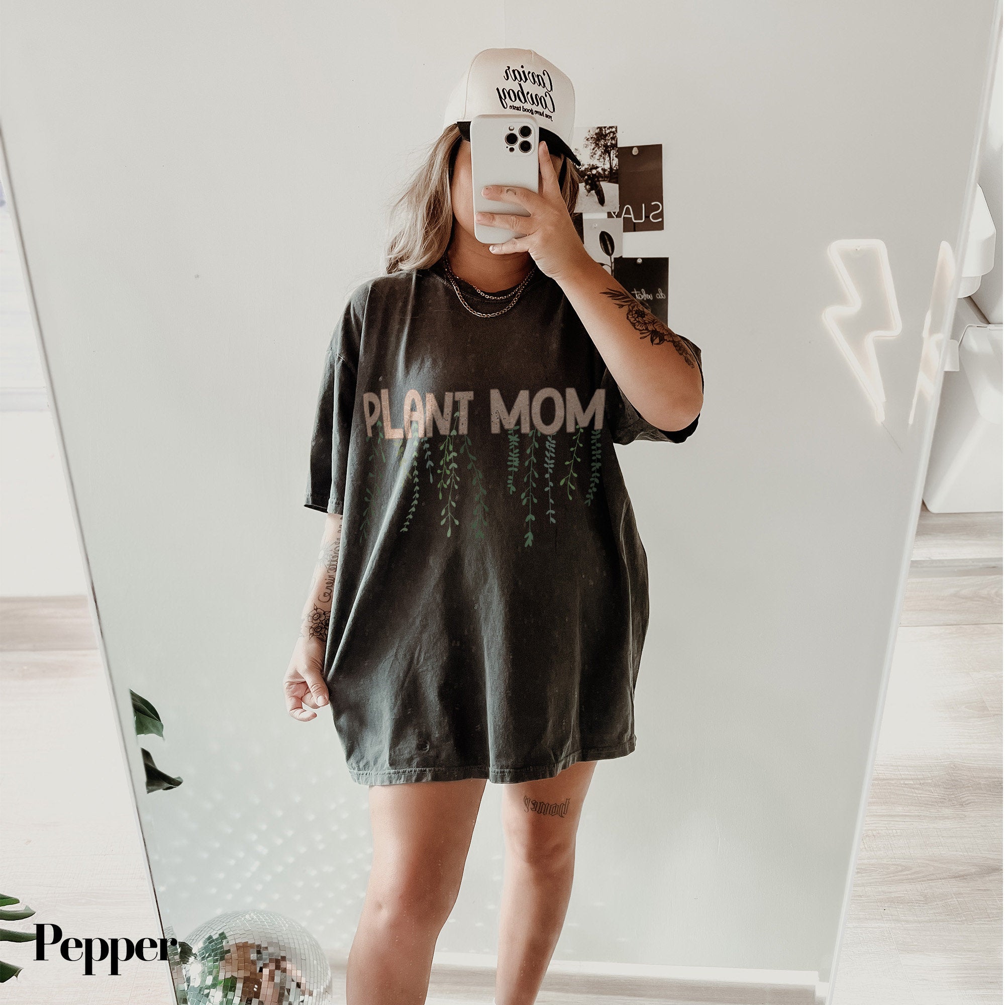 a woman taking a selfie in front of a mirror