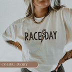 a woman wearing a white shirt with a lightning bolt on it