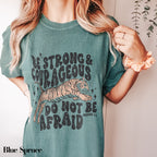 a woman wearing a green shirt with a tiger on it