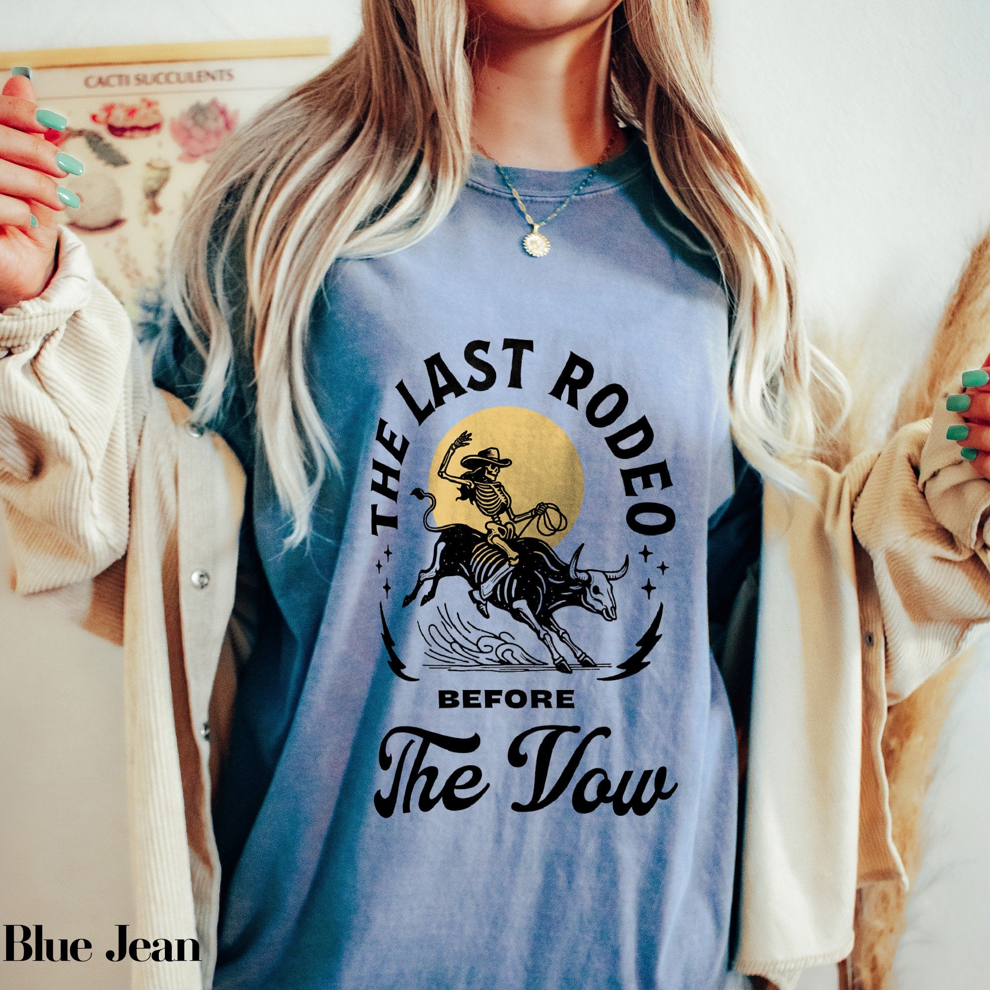 a woman wearing a blue shirt with the last rodeo before the slow on it