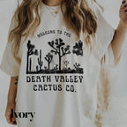 a woman wearing a t - shirt that says, welcome to the death valley cactus