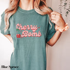 a woman wearing a cherry bomb t - shirt