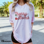 a woman wearing a pink shirt and black shorts