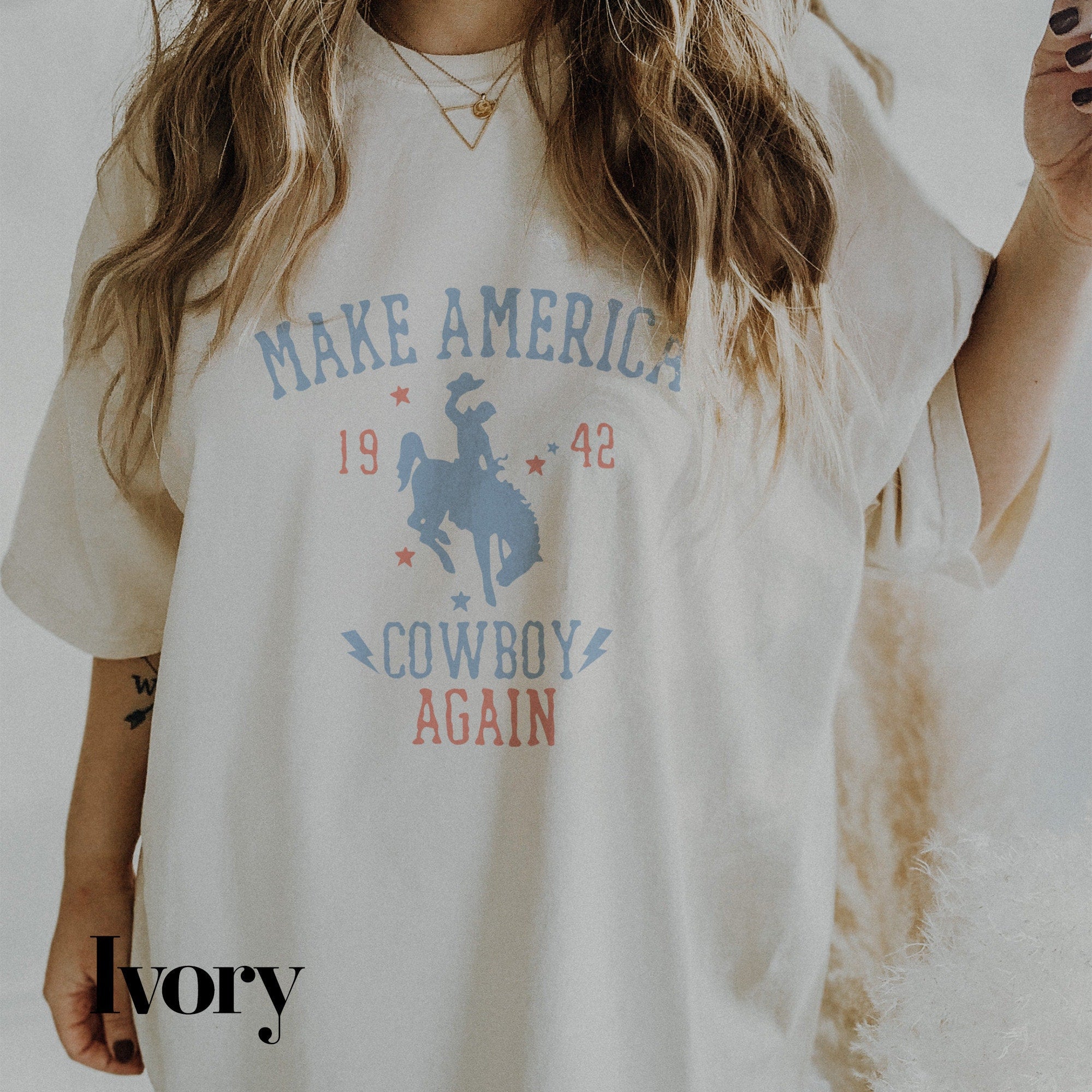 a woman wearing a cowboy t - shirt and smoking a cigarette