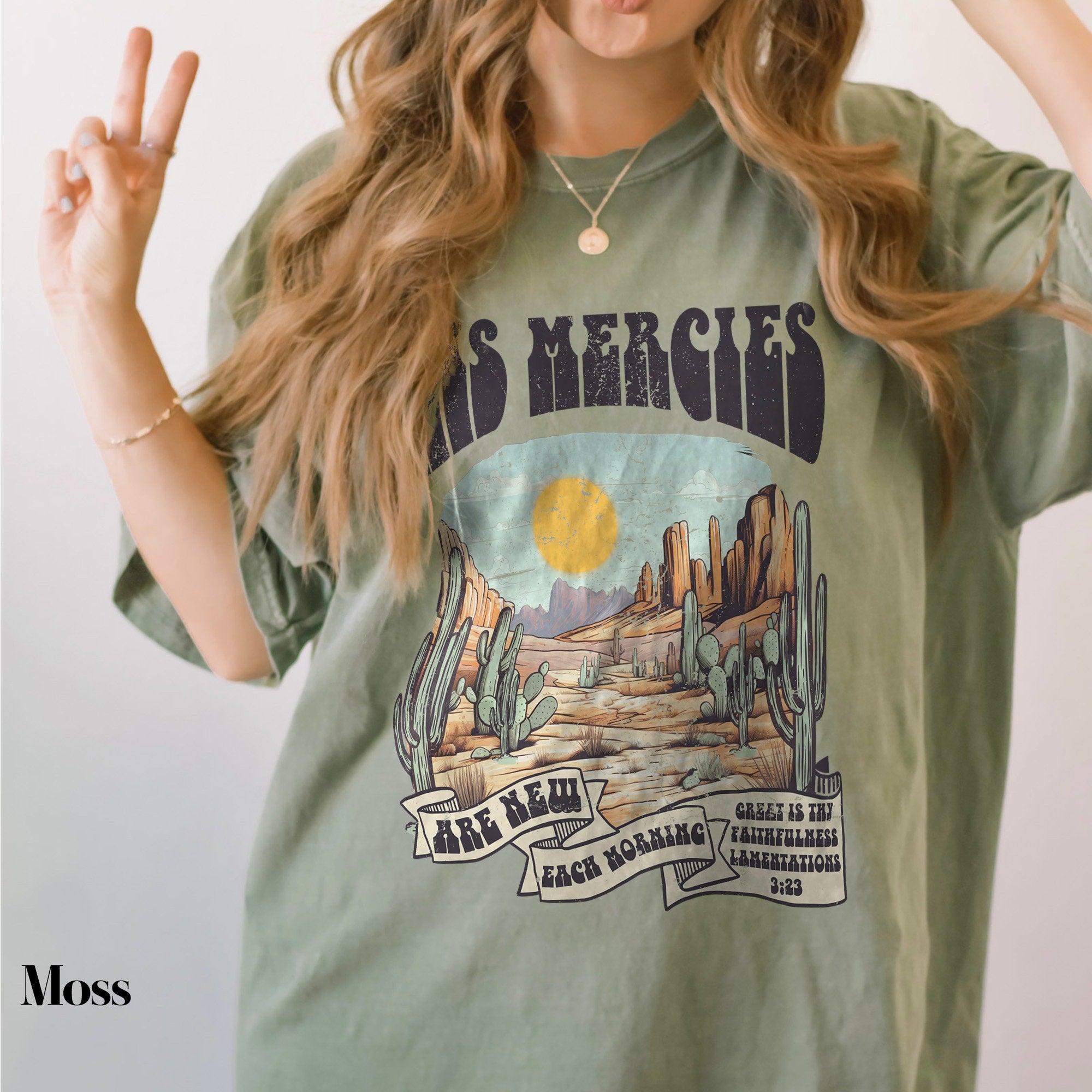 a woman with long hair wearing a green shirt