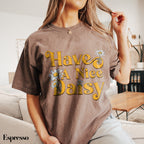 a woman sitting on a couch wearing a t - shirt that says have a nice