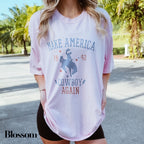 a woman wearing a pink shirt and black shorts