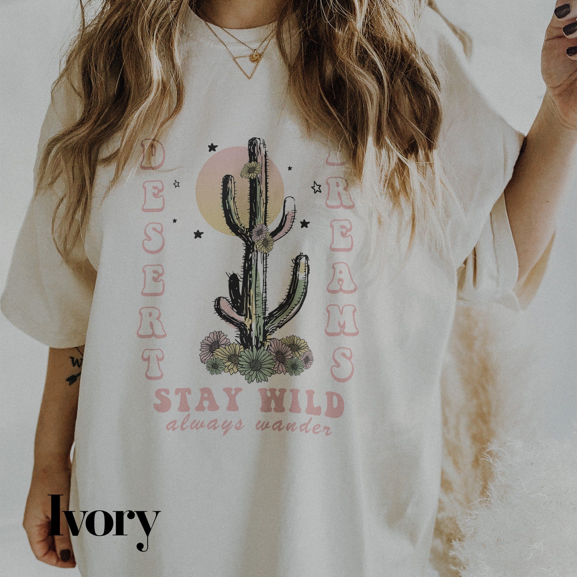 a woman wearing a white shirt with a cactus on it