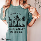 a woman wearing a t - shirt that says, welcome to the death valley cactus