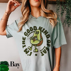 a woman wearing a t - shirt that says the good kind of avocado