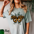 a woman wearing a tee shirt with a butterfly on it