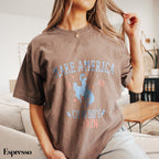 a woman sitting on a couch brushing her hair