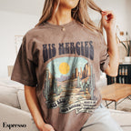 a woman sitting on a couch wearing a brown shirt