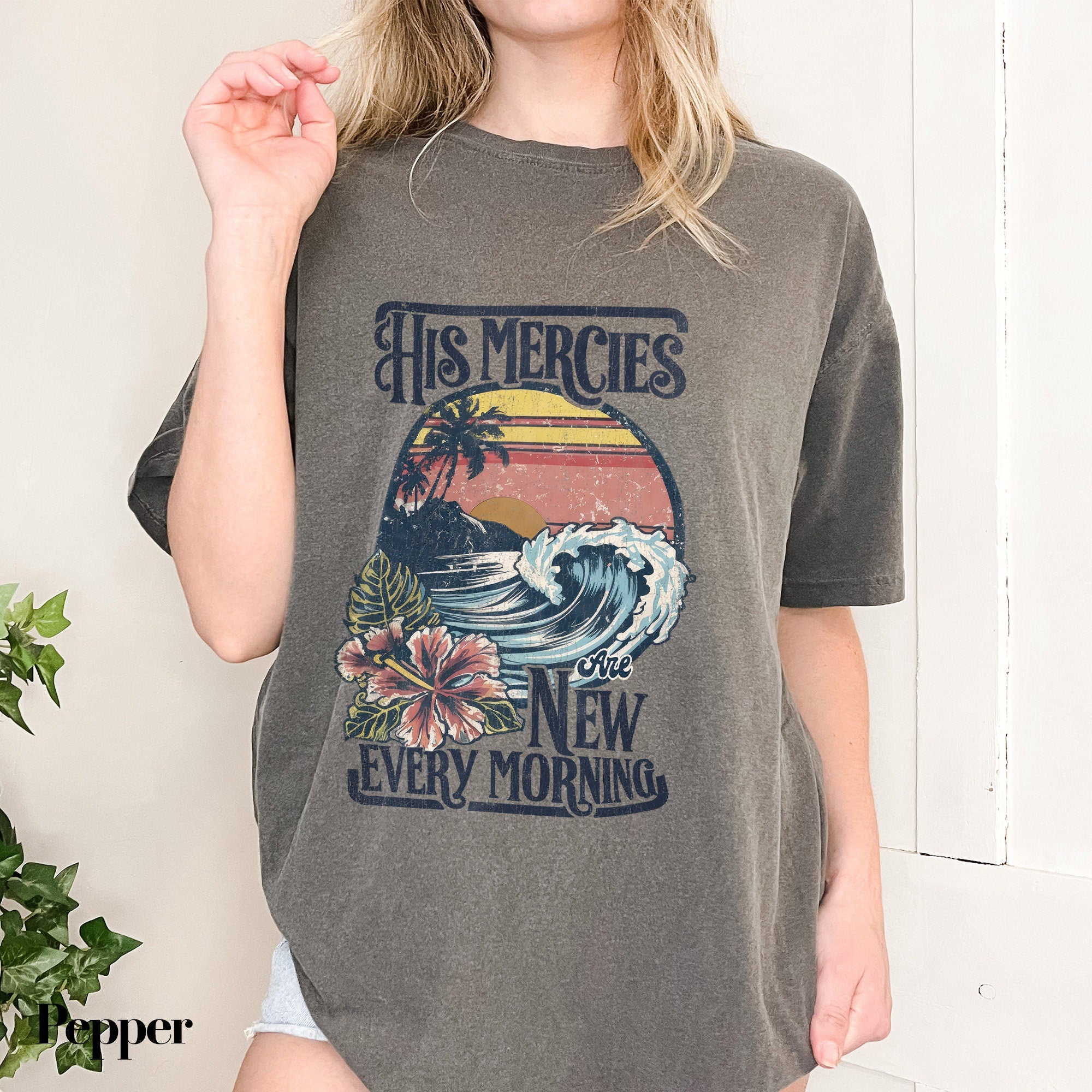 a woman wearing a t - shirt that says his mercies are new every morning