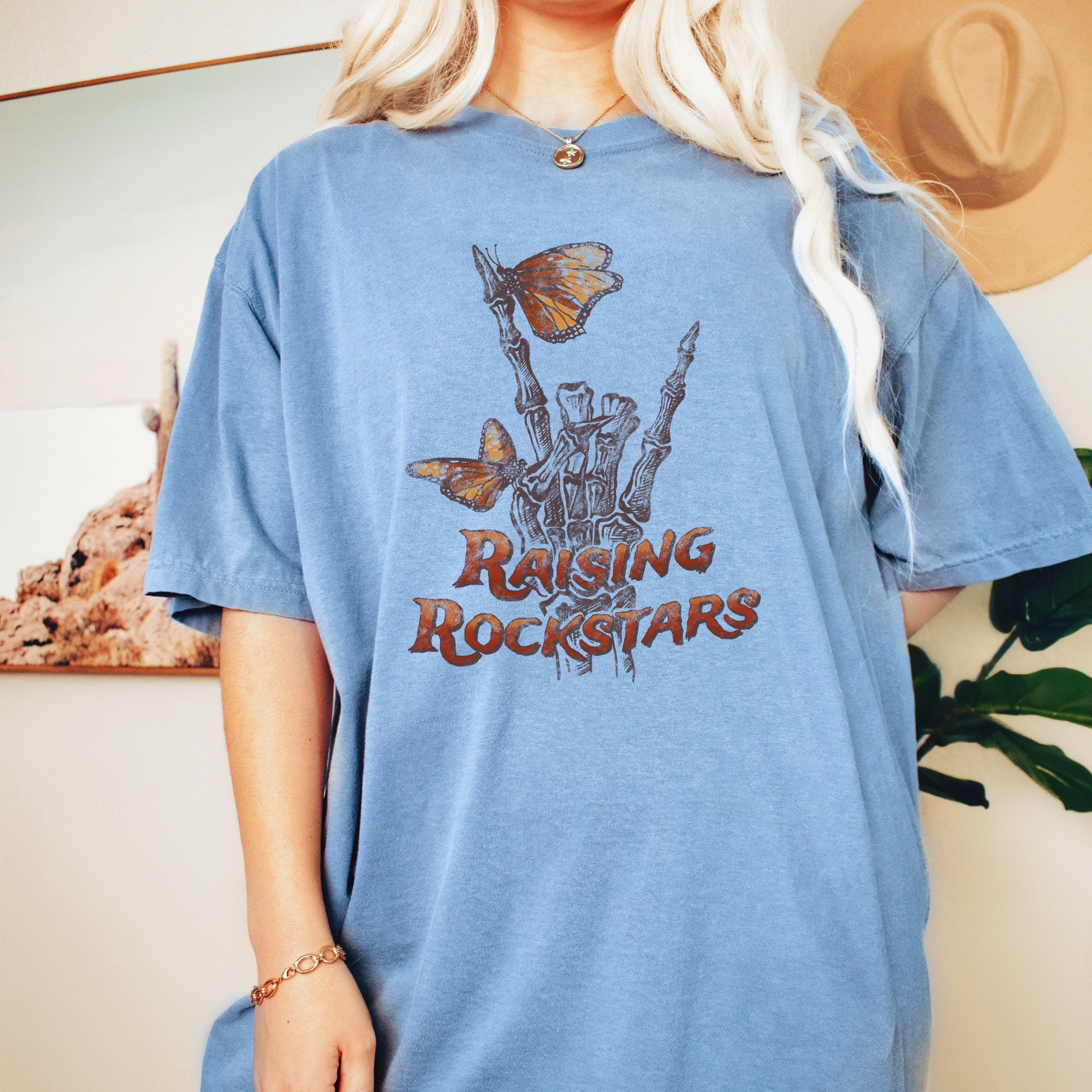 Raising Rockstars" Skeleton Hand Shirt
